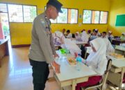 Pendistribusian MBG di Kuripan, Bhabinkamtibmas Turun Langsung!