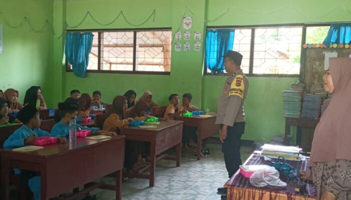 Polisi Kawal Program Makanan Bergizi Gratis di SDN 2 Ombe